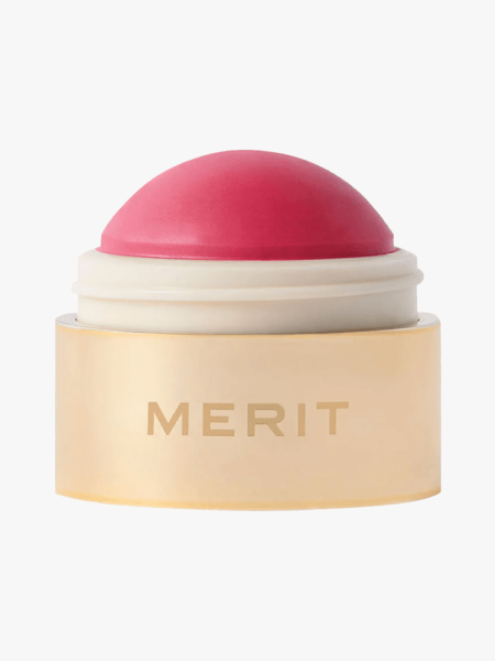 Merit Flush Balm in branded component on a light gray background